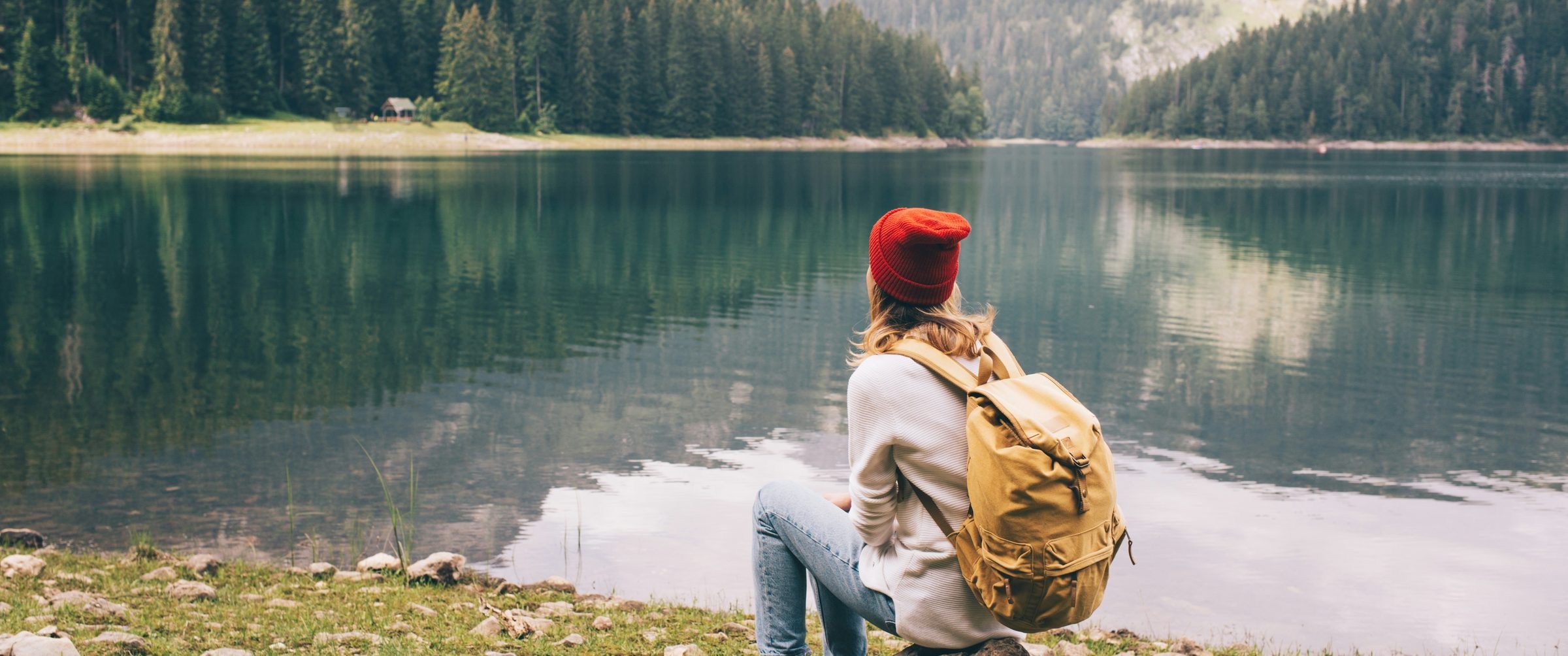 Photo aspect ratio example: a hiker by a mountain lake cropped to a wide 2.39:1 frame