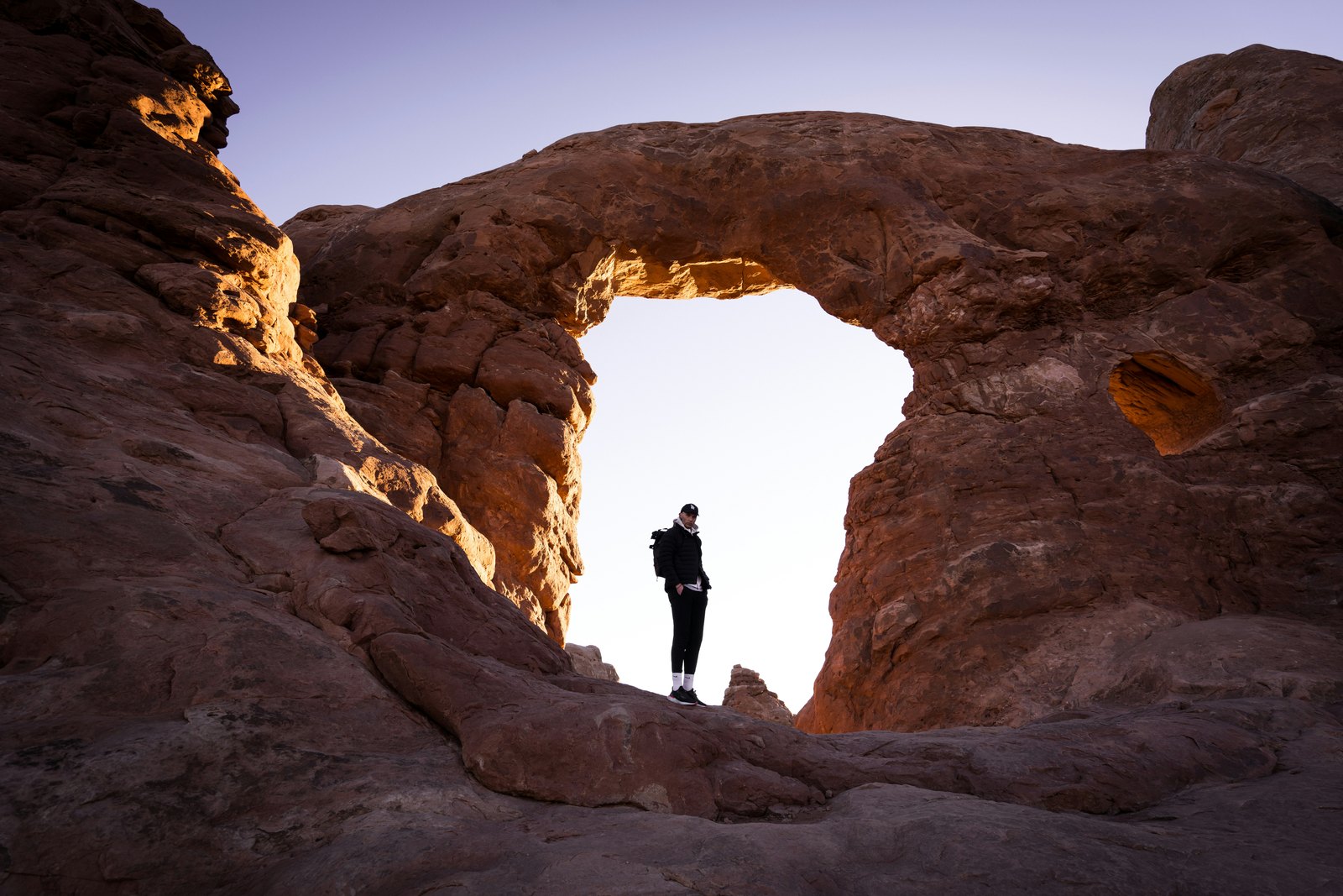 The full-frame photo at 16mm, with the whole rock arch and the rocks on both sides