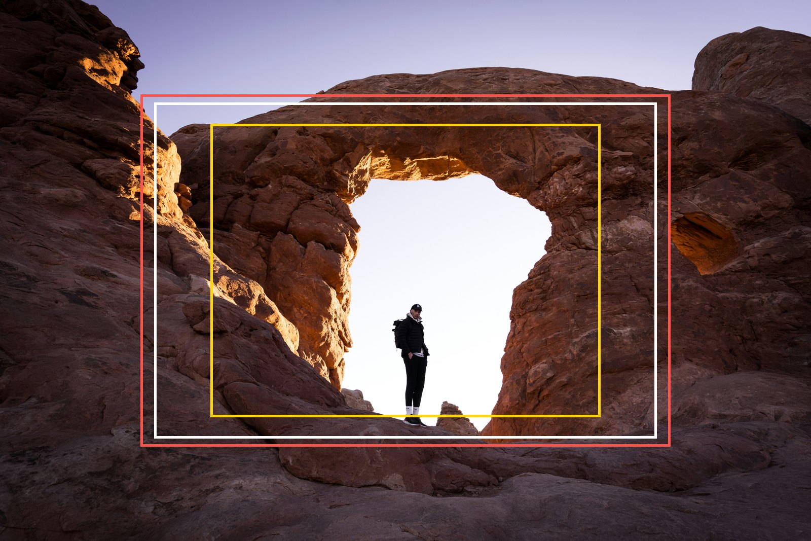 Full frame vs APS-C crop factor shown on one photo: frames for APS-C 1.5x, Canon APS-C 1.6x and Micro Four Thirds drawn over a full-frame shot of a person standing in a rock arch
