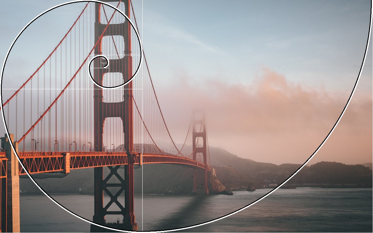 Golden spiral overlay on the Golden Gate Bridge, sweeping round the frame and ending on the near tower