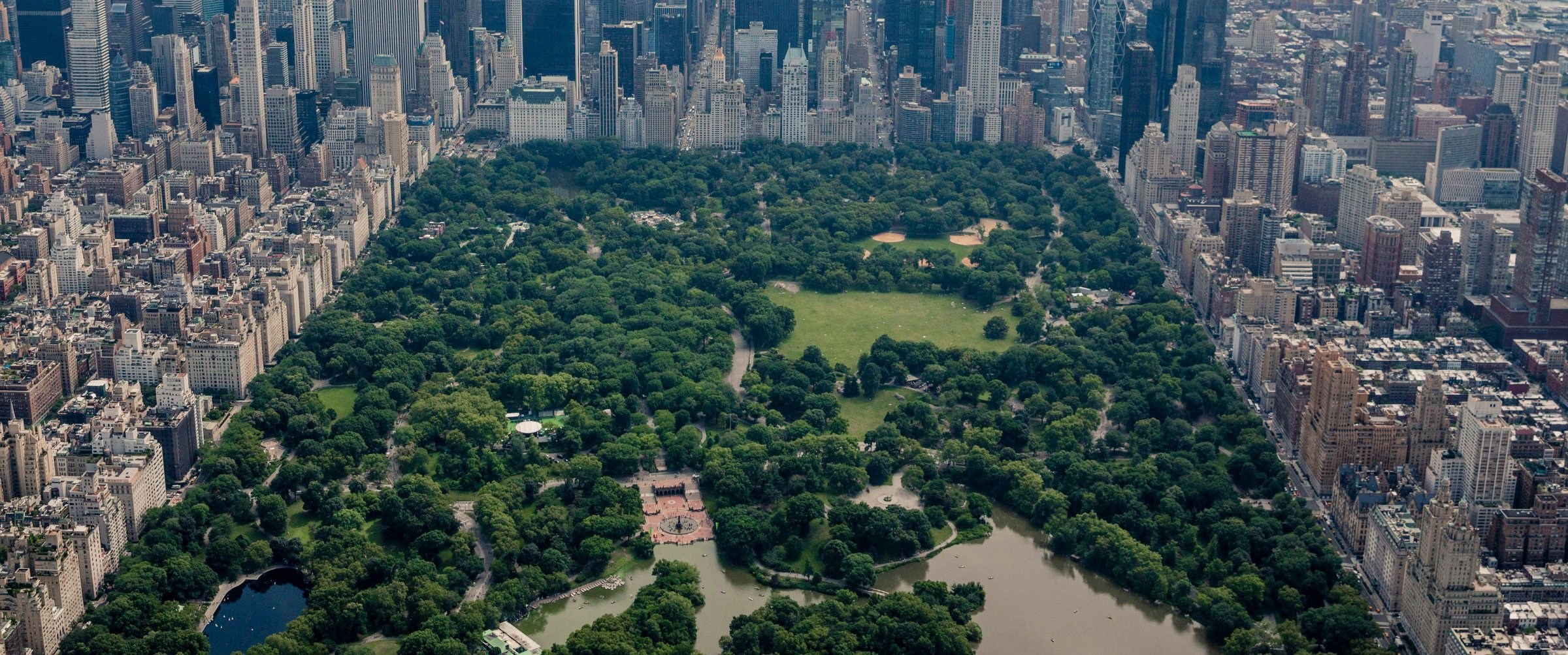 Juxtaposition in photography: an aerial view of Central Park, a rectangle of trees boxed in by the buildings of Manhattan