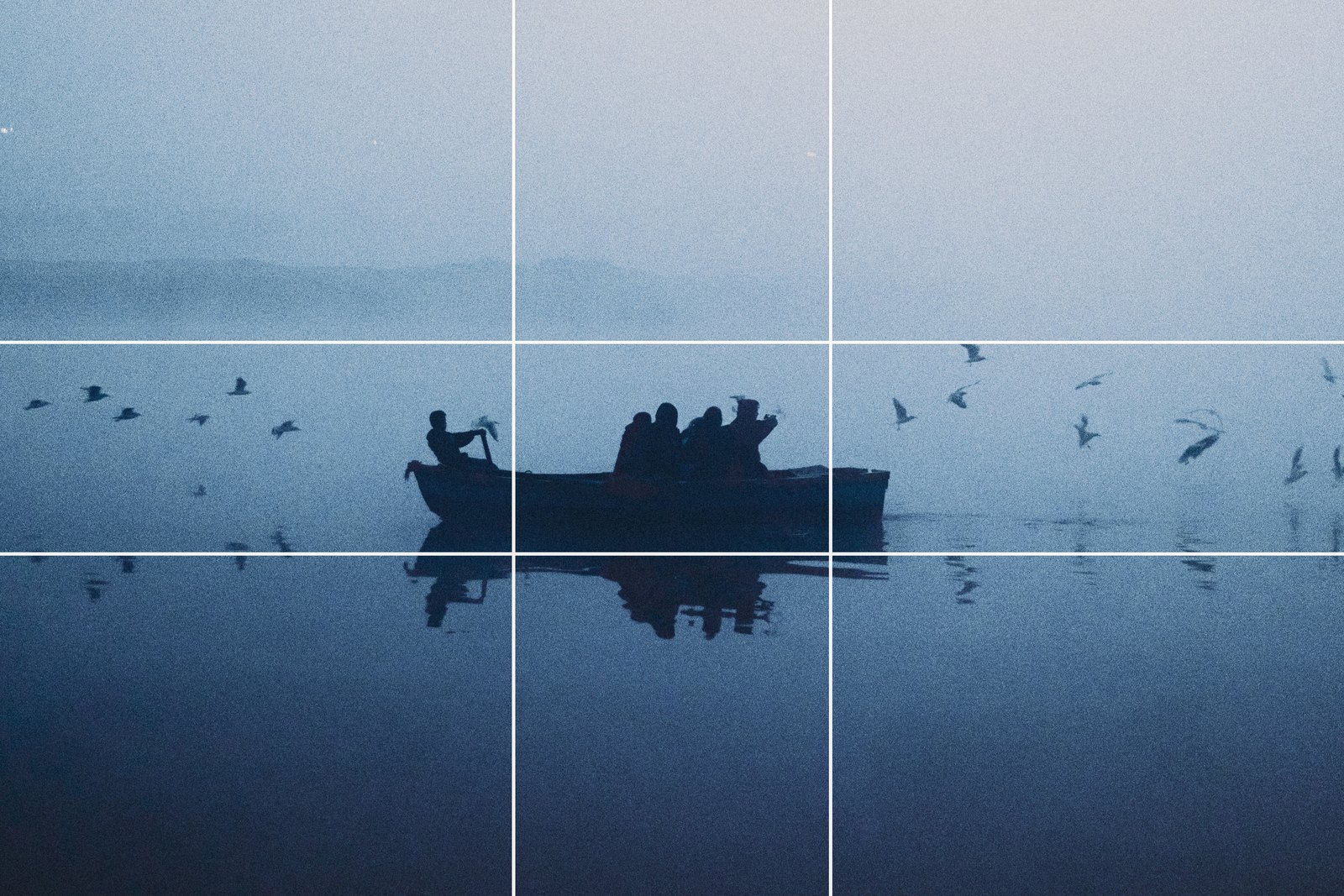 The same rowing boat in fog with the golden ratio grid overlaid, lines slightly nearer the centre