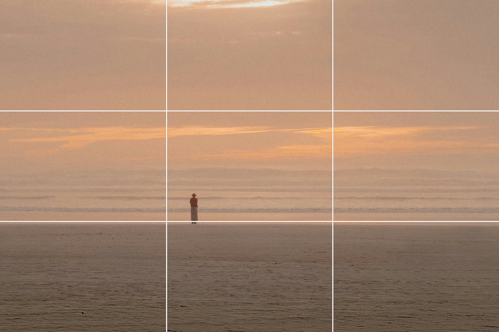 Rule of thirds after: the same beach cropped so the horizon sits on the bottom grid line and the lone figure on the left line